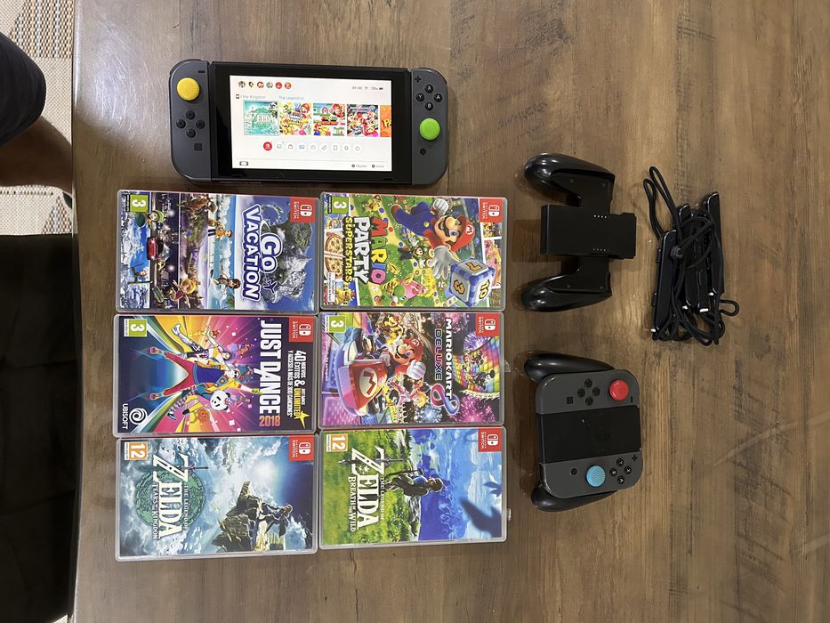 Nintendo switch com 4 comandos e 6 jogos