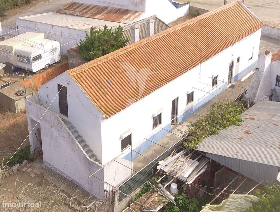 Detached semi-detached house with two independent apartments and land...