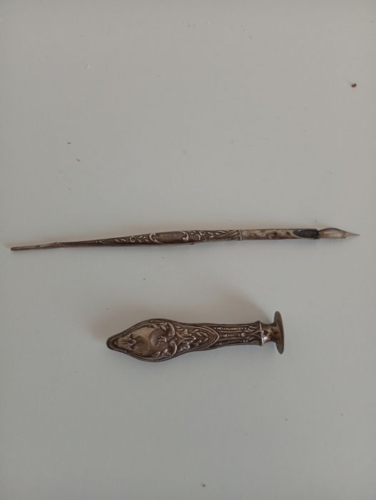 Prata, caneta e sinete