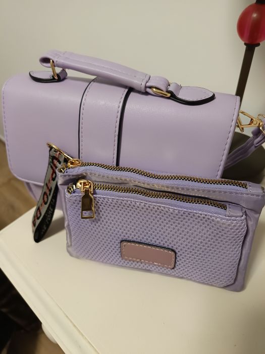 Mala de mão e a tiracolo e porta moedas