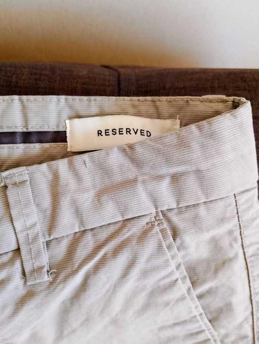 RESERVED. Kremowe spodnie męskie.