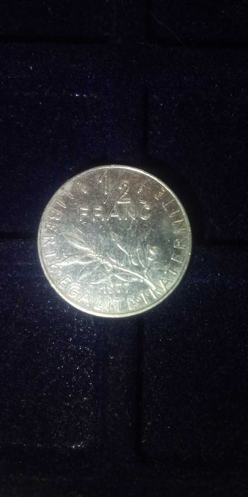 Moeda francesa de 1/2 franc de 1977