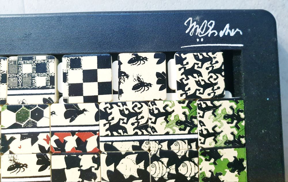 M.C. Escher "Metamorphose" Quebra cabeça deslizante