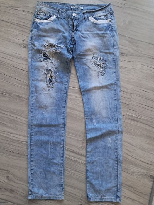 Spodnie jeans z dodatkami damskie