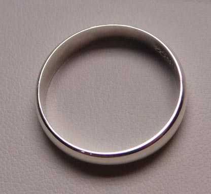 Srebrna gładka obrączka R.24 szerokość 4,8 mm.