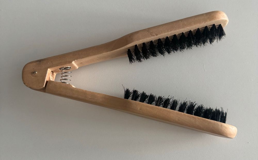 Escova de alisar o cabelo