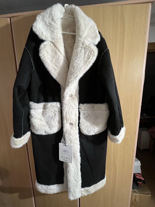 Casaco reversível preto/bege