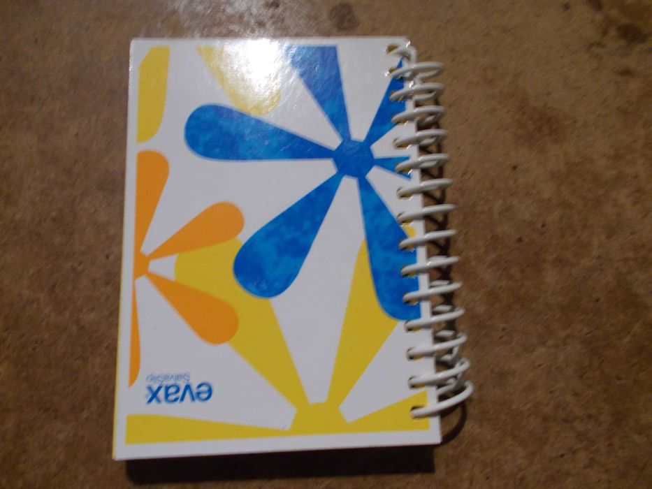 pequeno caderno em espiral da Evax