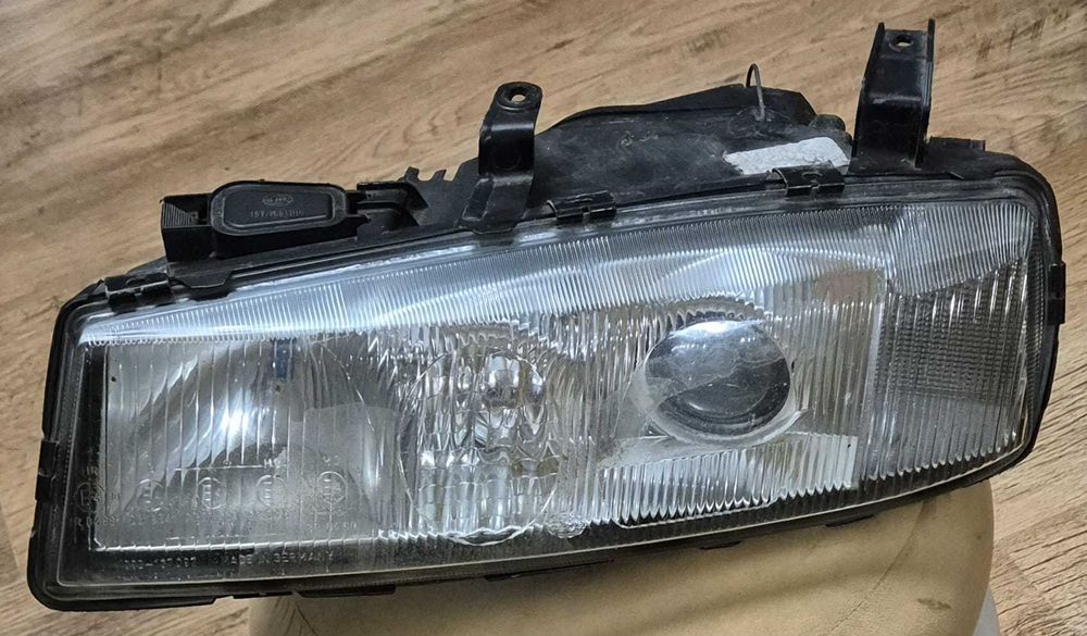 Lampa Przednia Lewa OPEL CALIBRA (89-97r.) Oryginalna HELLA