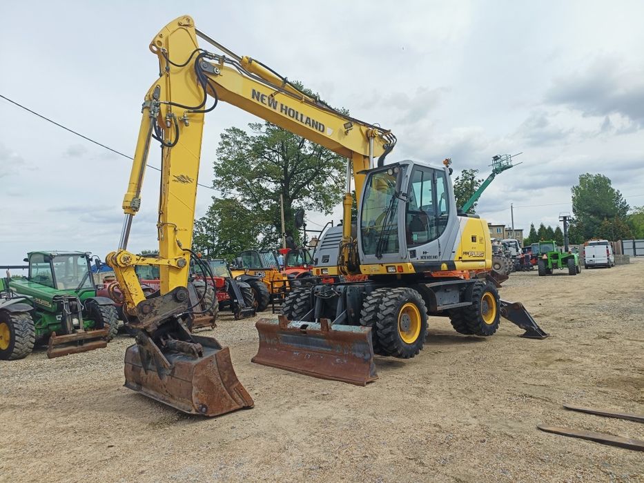 Maszyna budowlana koparka New Holland MH Plus  Ramie LONG