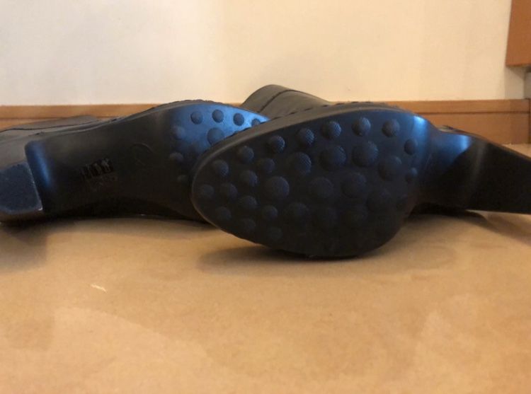 Botas em pele de camp alto da marca EXé