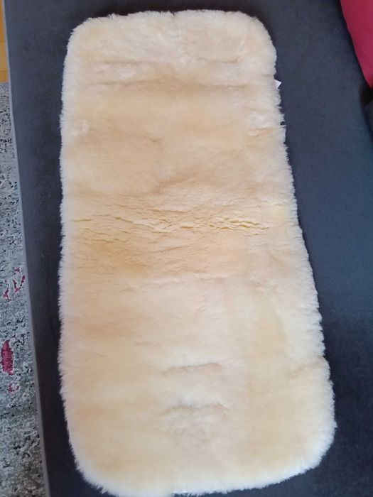 Podkład do wózka merino. Nakładka że skóry jagnięcej do wózka.