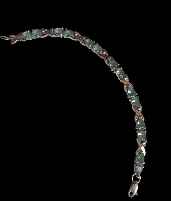 Срібний браслет з золотими пластинами та топазами.