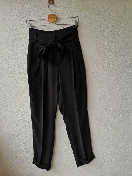 Calças pretas com laço da Caramelo