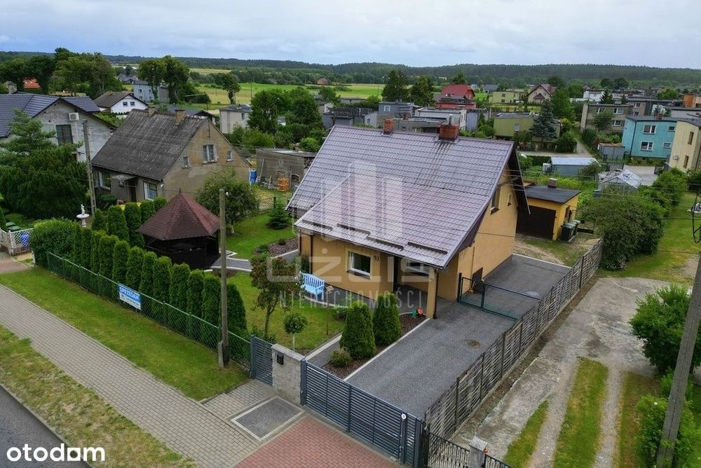 Dom z garażem i budynkiem gospodarczym