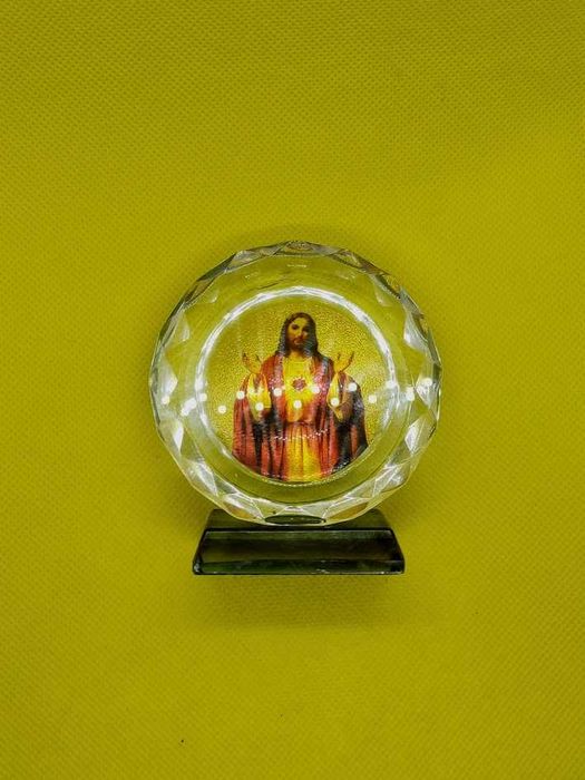 Imagem religiosa formato circular com base de Jesus Cristo