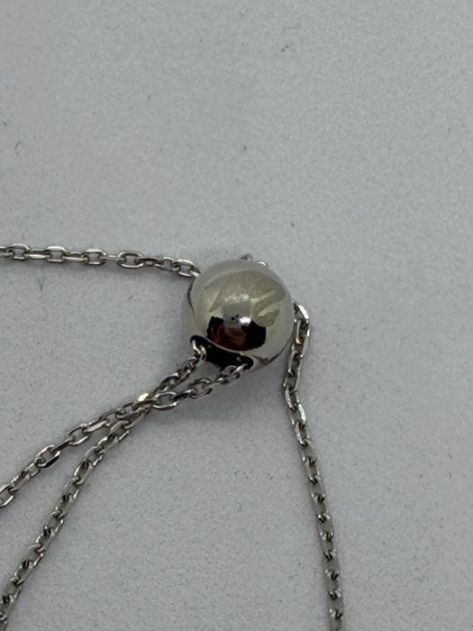 Bransoletka ściągana z zielonym oczkiem sygn Swarovski