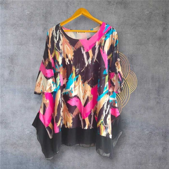 Tunika z asymetrycznym dołem.