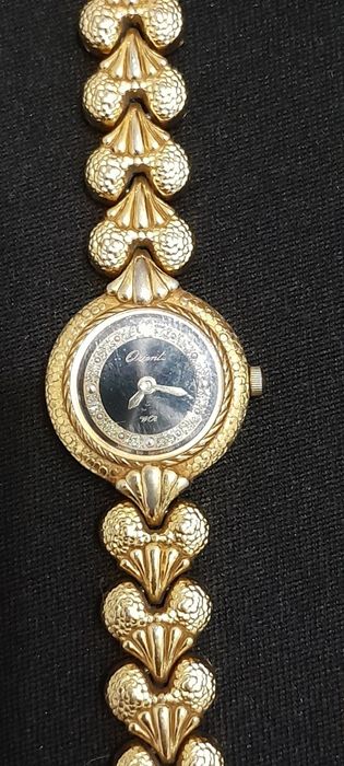 Relógio de senhora de corda muito ilegante.