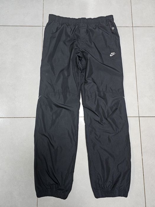 Nike Sportswear spodnie do biegania roz.M wodoodporne