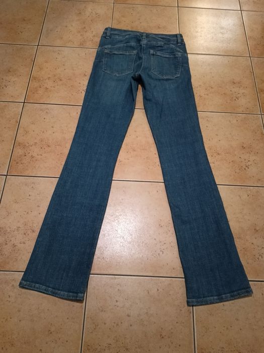 Spodnie dzwony dżinsowe, bootcut high rise. Rozmiar M. Push up.