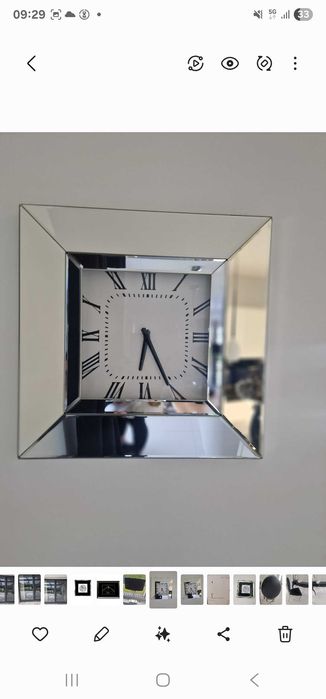 Zegar w lustrzanej ramie