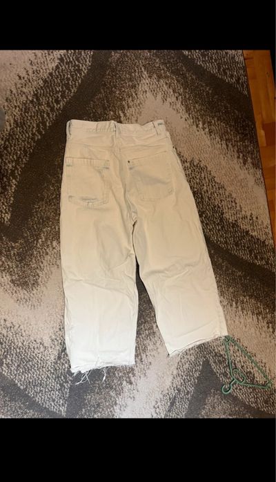 Spodnie baggy jeans z dziurami