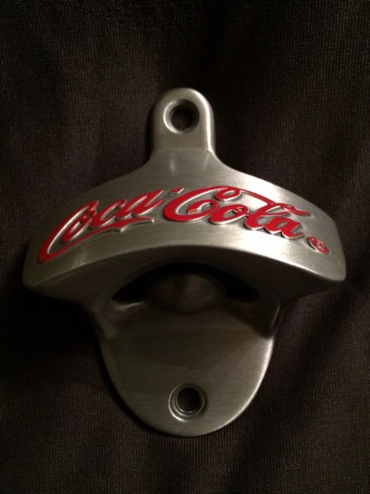 coca cola abre garrafas cápsulas