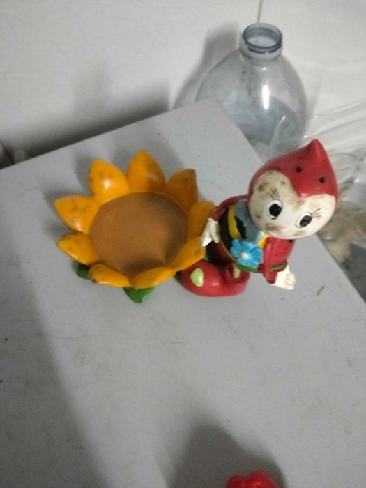 Peça em barro joaninha e o girassol