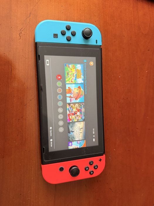 Nintendo Switch V2 (Caixa e Acessórios) + Mala + 7 Jogos