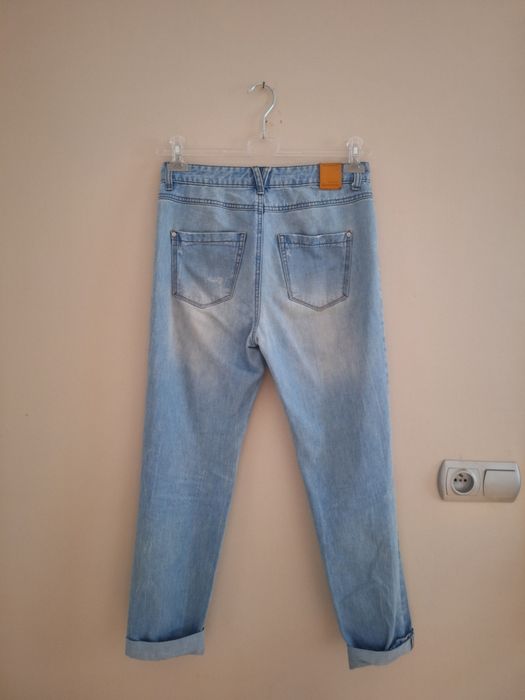 Modne spodnie jeansy z dziurami boyfriend stradivarius xs 34