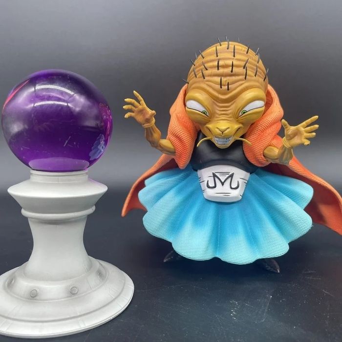 Figura dragon ball com bola de luz
