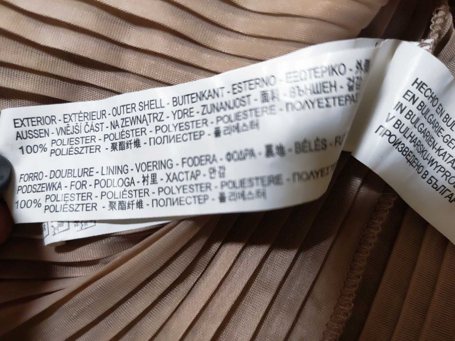 Casaco de manga curta com detalhes dourados