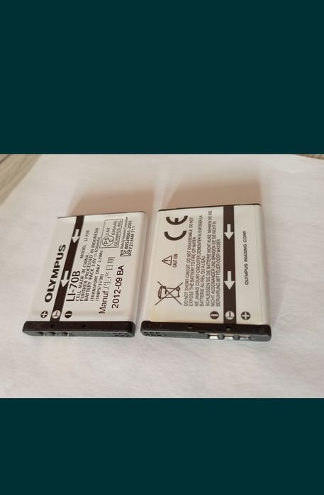 олімпус фотік заклинив об'єктив.Також є батарея