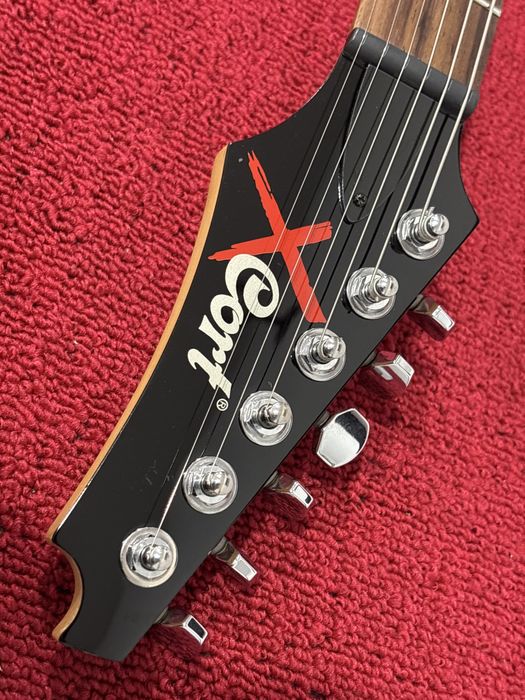 Cort X2, progi ze stali nierdzewnej, siodełko TUSQ, struny ELIXIR