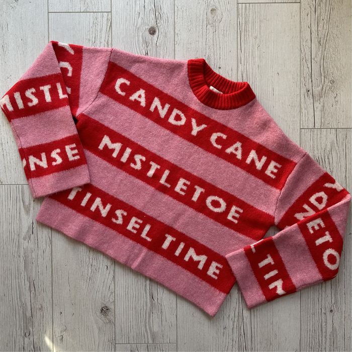 Różowy żakardowy sweter świąteczny oversize h&m candy cane mistletoe
