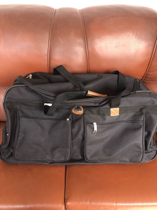 Trailer com rodas ou saco viagem mala