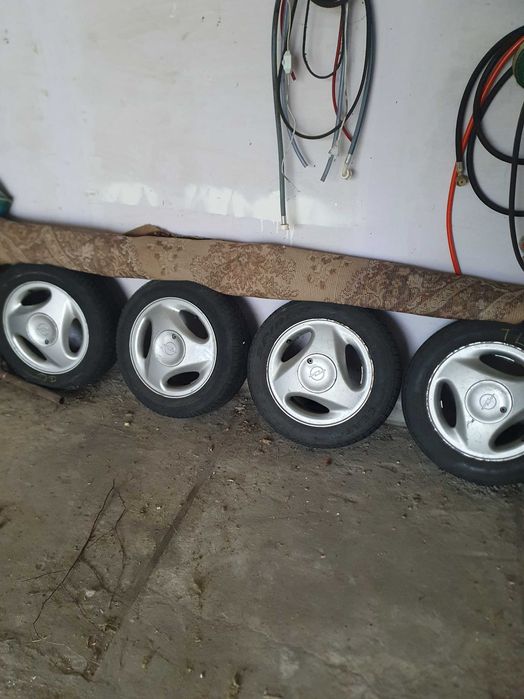 OPEL CORSA felgi aluminiowe z oponami 4X100 ET49 5.5J 14"