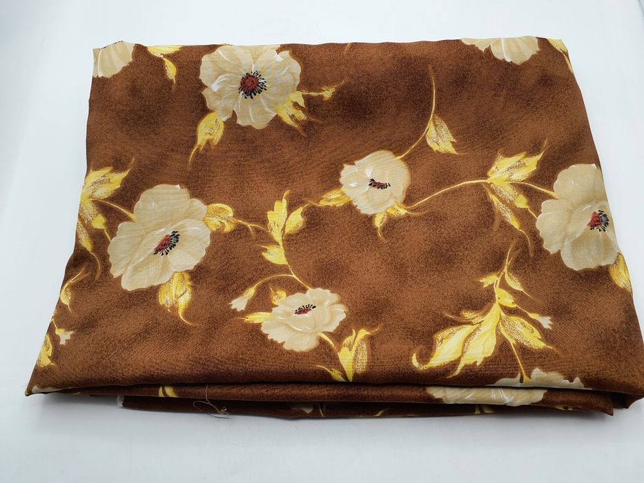 Tkanina jasny brąz w kwiaty szer.145 cm.Promocja