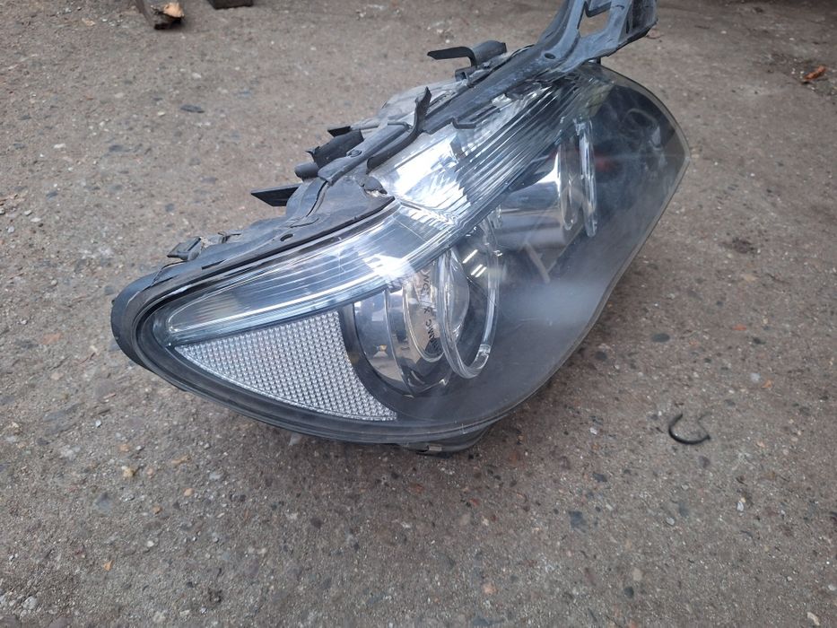 E65 lampa prawa uszkodzona