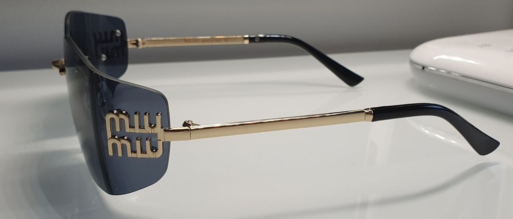 Okulary damskie Miu Miu