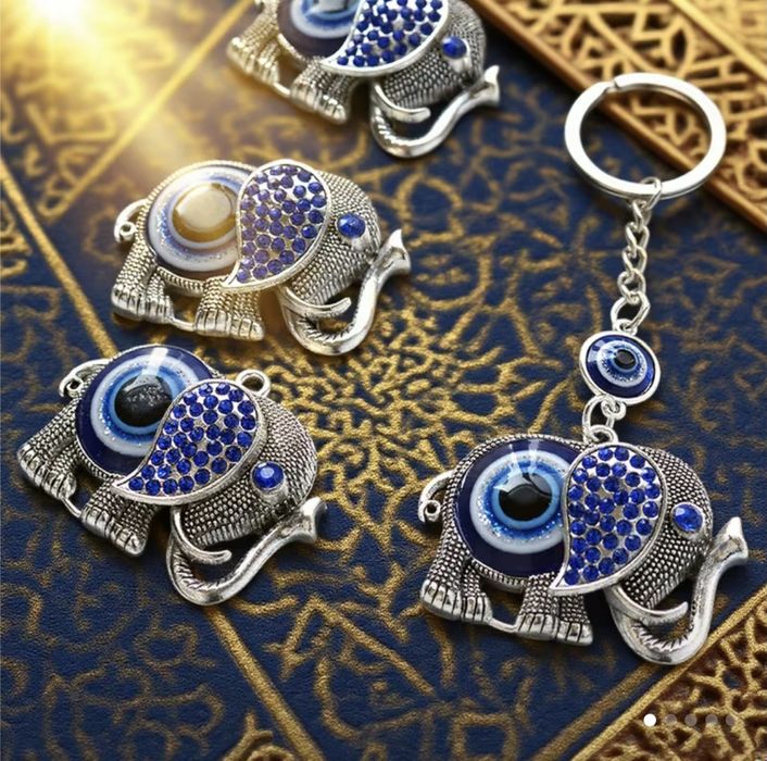 Elegancki breloczek z okiem Fatimy z pięknym Słoniem.