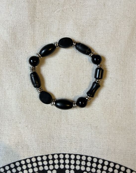 Pulseira preta. Nunca usada.