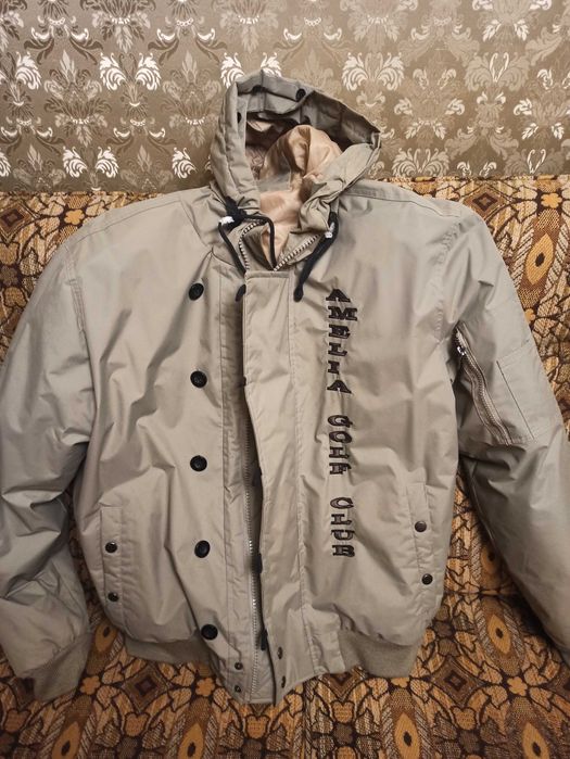 Пуховик оливковий