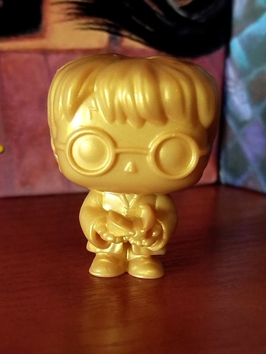 Золота фігурка Гаррі Поттер