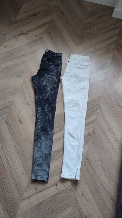 Białe spodnie damskie jeansy z zamkami S 36