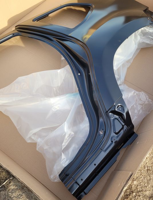 Dacia Duster I 1 błotnik tylny lewy poszycie