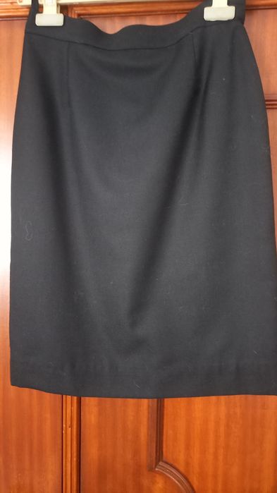 Fato de traje académico de mulher.