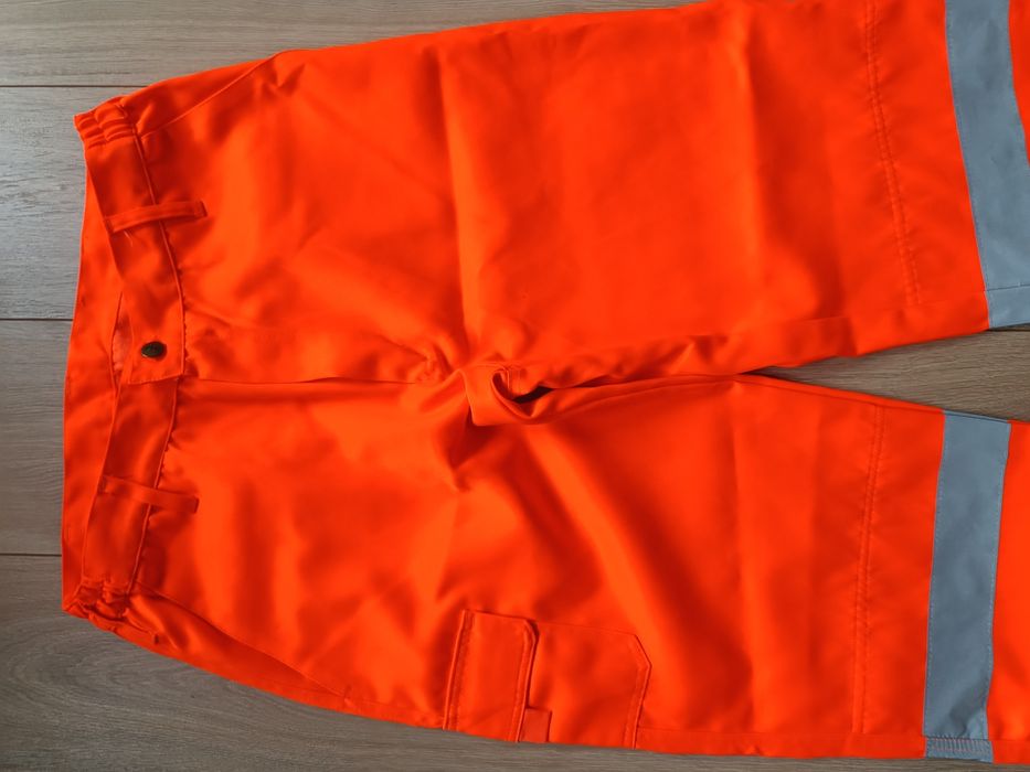 Męskie spodnie robocze pomarańczowe odblaskowe jak nowe Warrior