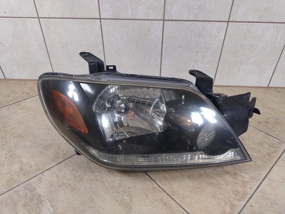 Mitsubishi Outlander I 1 lampa prawy przód Europa reflektor wysyłka